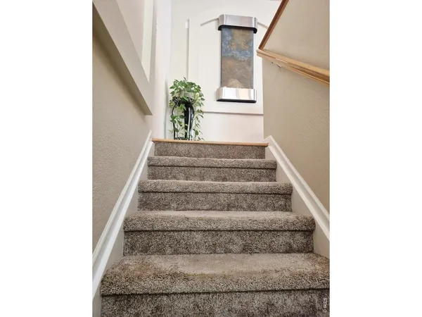 a view of staircase with white walls