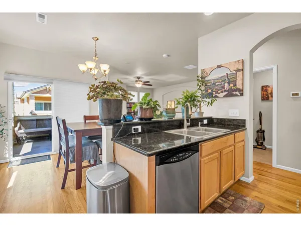 a kitchen with a table and chairs