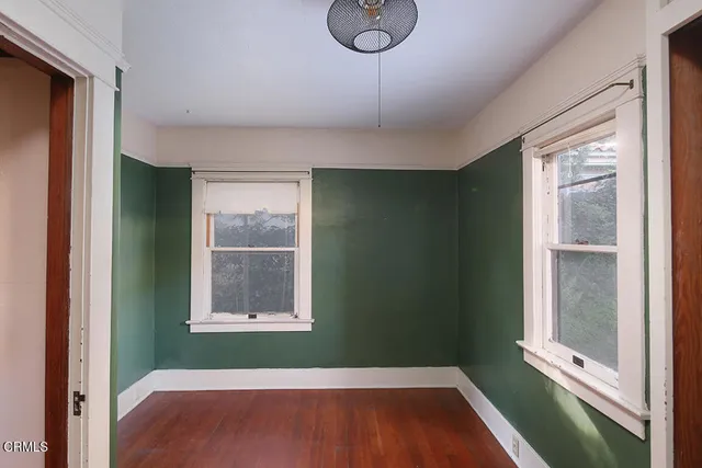 a view of an entryway with wooden floor