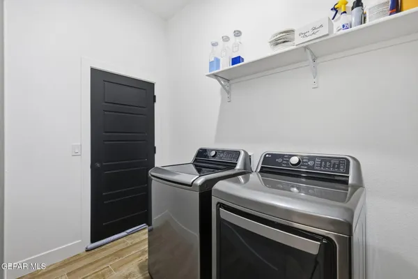 a view of storage and utility room with washer and dryer