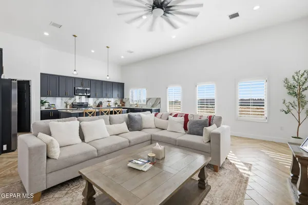 a living room with furniture and a large window