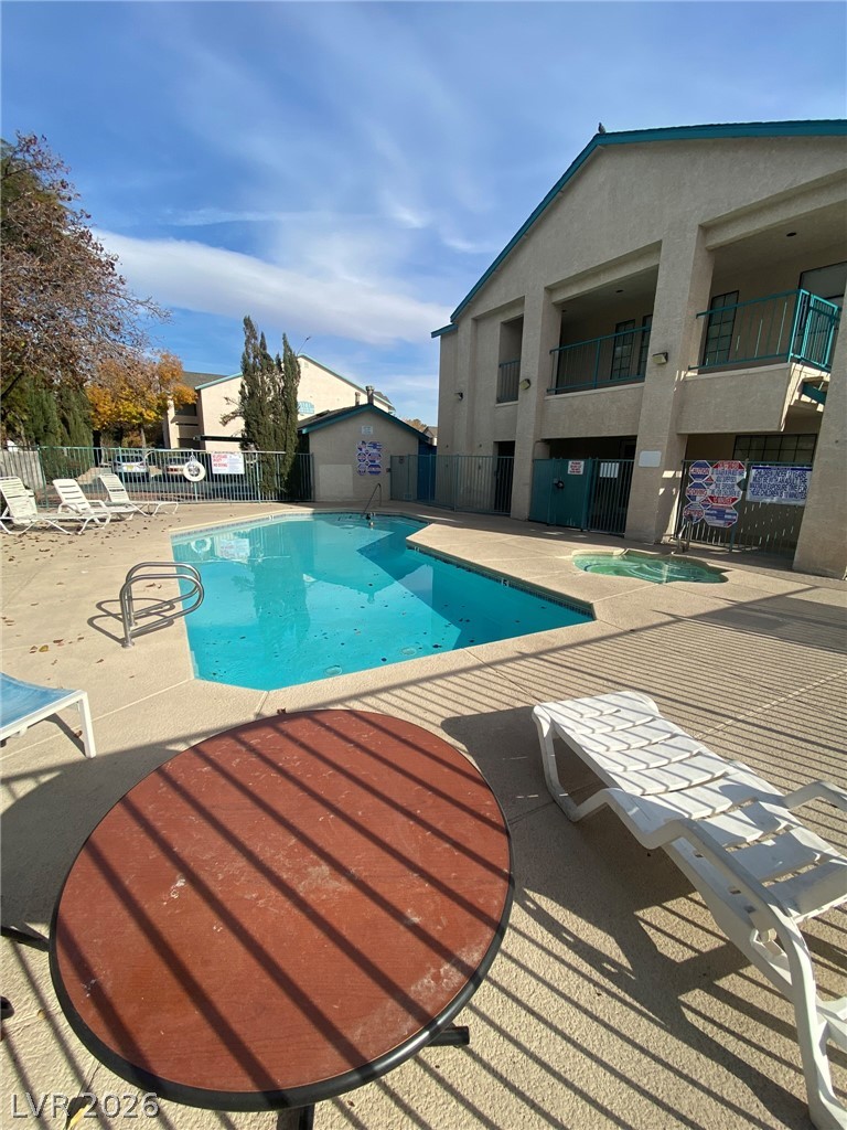 5271 South Lindell Road, Unit 202 Las Vegas, NV 89118 - Photo 3 of 27 An inviting community pool and spa area offers relaxation and recreation.