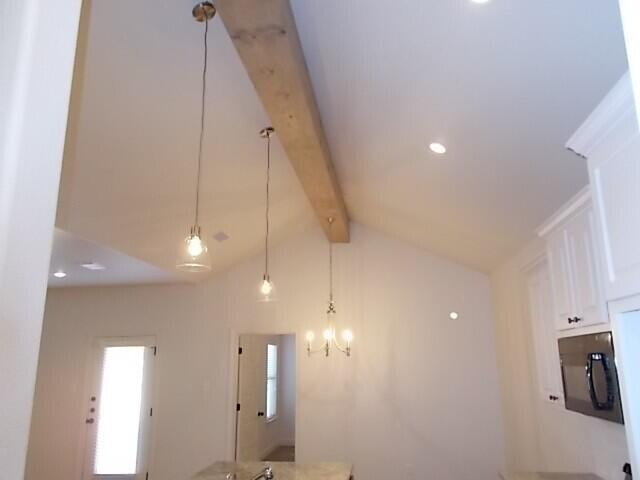2002 102nd Street, Unit B Lubbock, TX 79423 - Photo 2 of 17 a view of a kitchen and a window