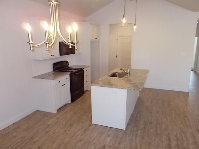 2002 102nd Street, Unit B Lubbock, TX 79423 - Photo 6 of 17 a room with cabinets and wooden floor