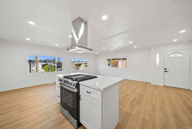 a kitchen that has a lot of cabinets in it