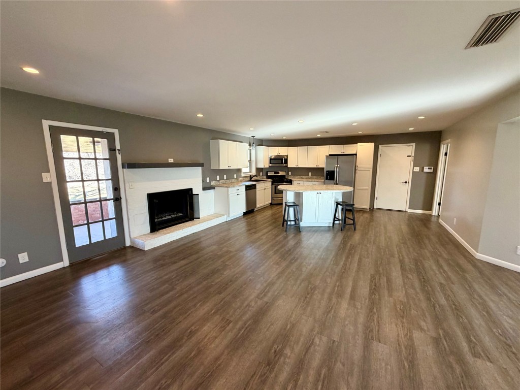 9712 Springdale Road Austin, TX 78754 - Photo 12 of 40 a view of a livingroom with furniture and a fireplace