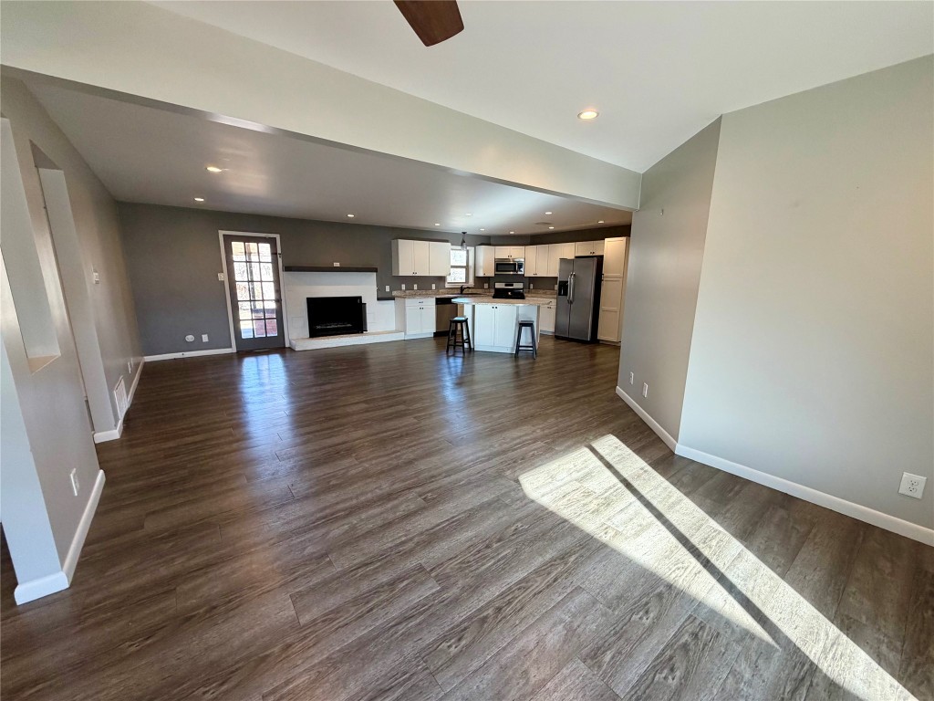 9712 Springdale Road Austin, TX 78754 - Photo 13 of 40 a view of empty room with wooden floor