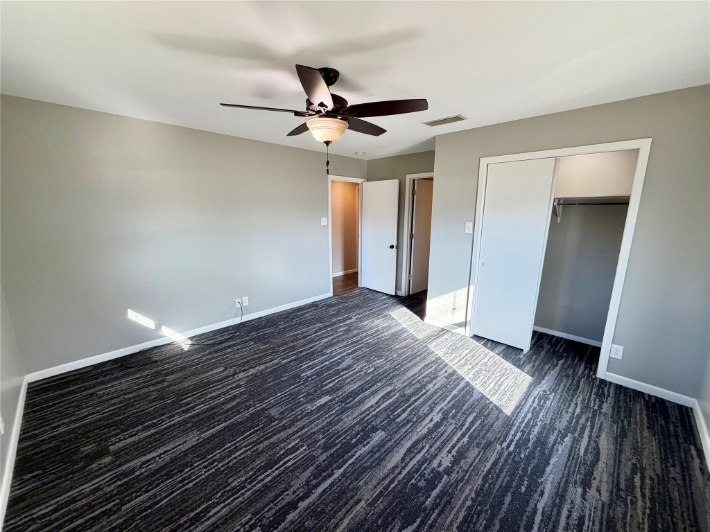9712 Springdale Road Austin, TX 78754 - Photo 17 of 40 a view of an empty room with wooden floor