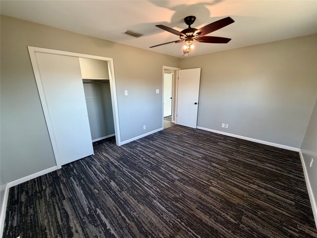 9712 Springdale Road Austin, TX 78754 - Photo 21 of 40 wooden floor in an empty room with a window