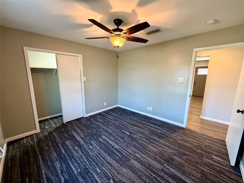 9712 Springdale Road Austin, TX 78754 - Photo 24 of 40 wooden floor in an empty room with a mirror