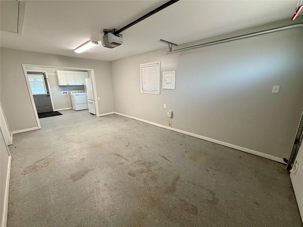 9712 Springdale Road Austin, TX 78754 - Photo 29 of 40 an empty room with windows and cabinet