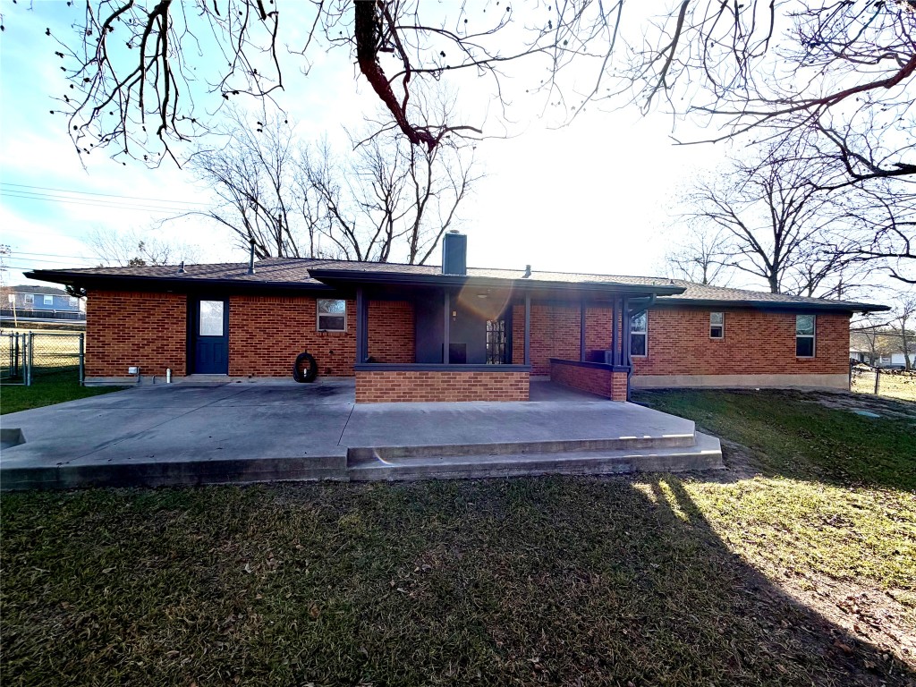 9712 Springdale Road Austin, TX 78754 - Photo 33 of 40 a front view of a house with a yard