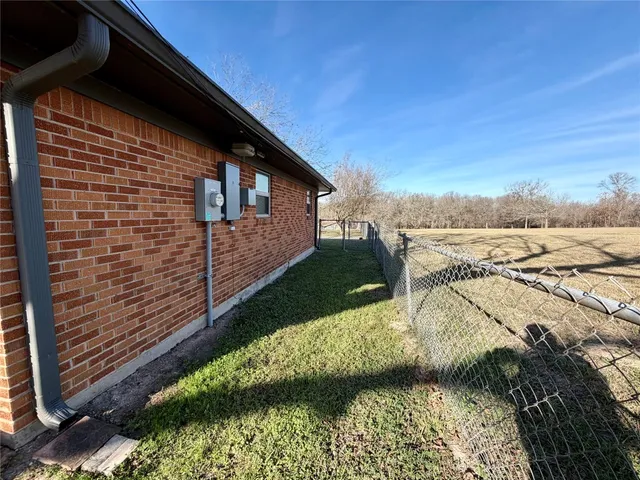 a view of a backyard of the house