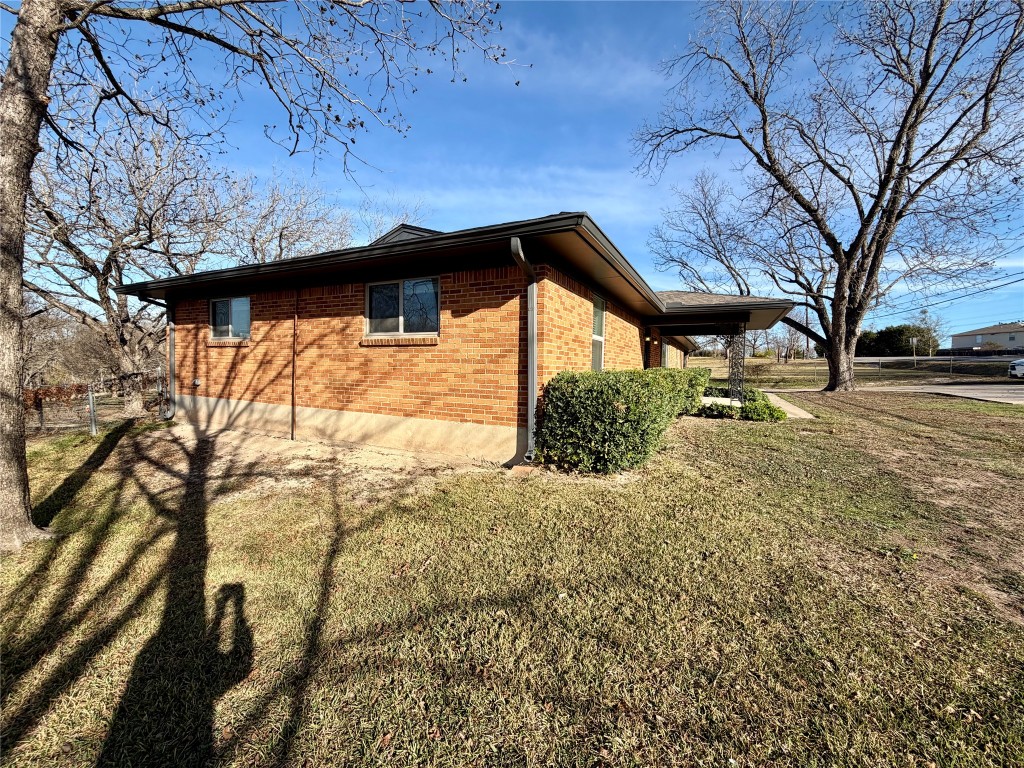 9712 Springdale Road Austin, TX 78754 - Photo 6 of 40 a backyard of a house with lots of green space