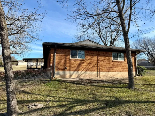 a view of a backyard of the house
