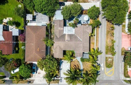 an aerial view of a house with a garden and plants