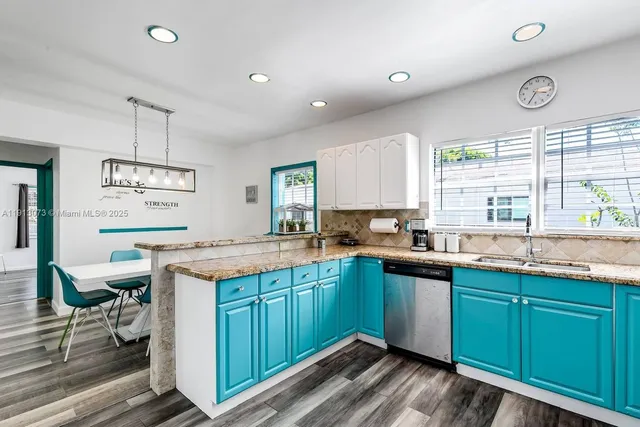 a kitchen with a sink and cabinets