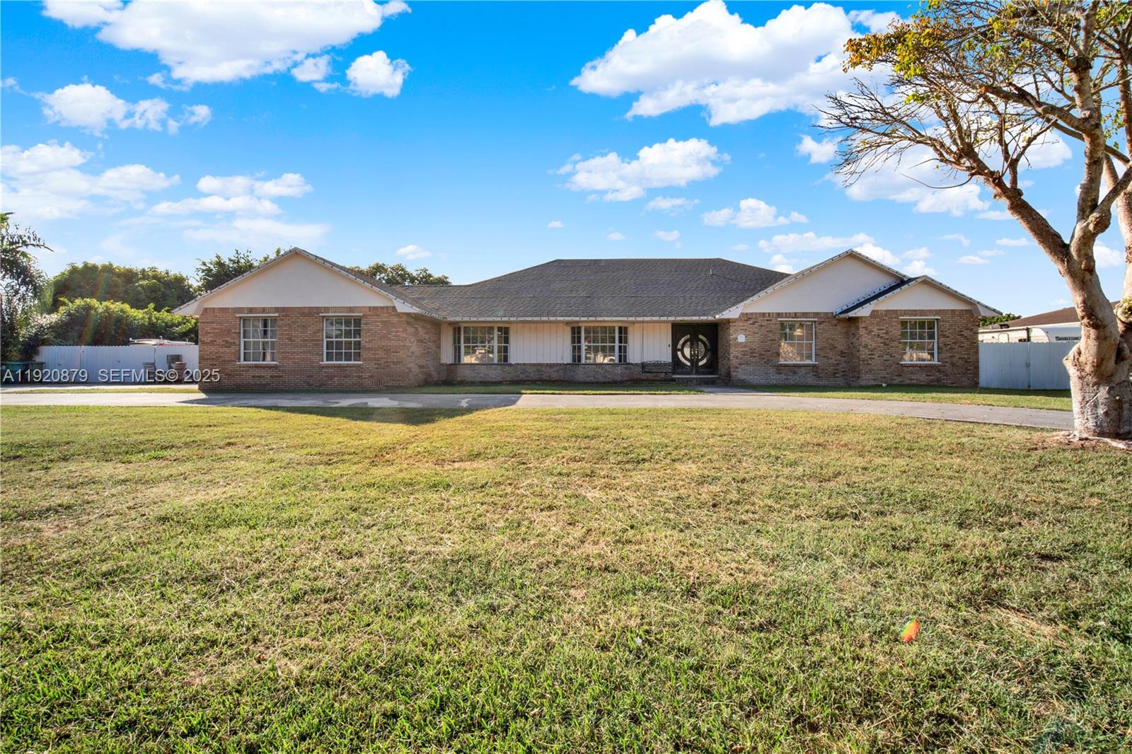 29472 Southwest 193rd Court Homestead, FL 33030 - Photo 1 of 44 a view of a house with a big yard
