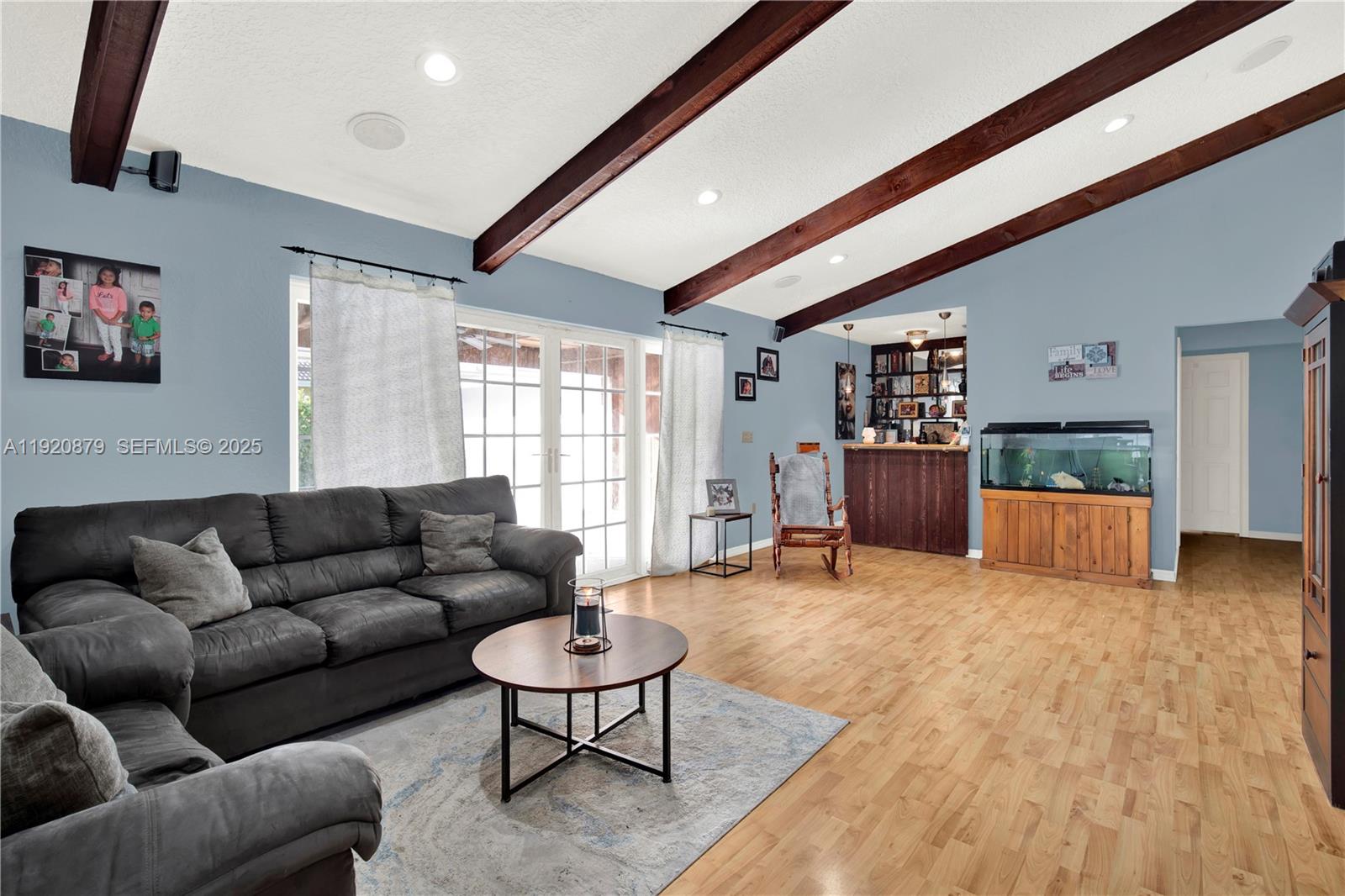 29472 Southwest 193rd Court Homestead, FL 33030 - Photo 13 of 44 a living room with furniture and a flat screen tv