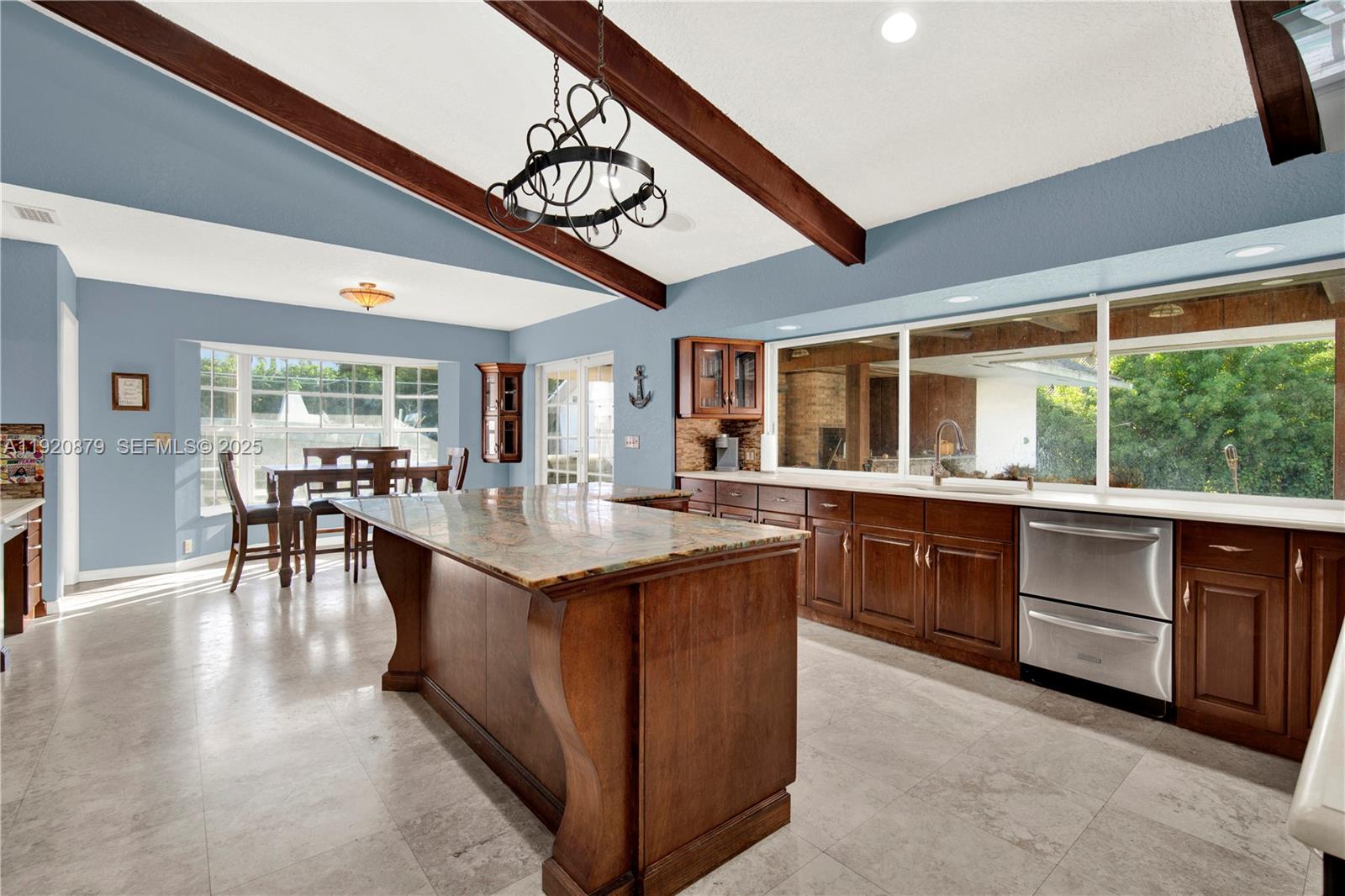 29472 Southwest 193rd Court Homestead, FL 33030 - Photo 15 of 44 a kitchen with lots of counter top space and dining table
