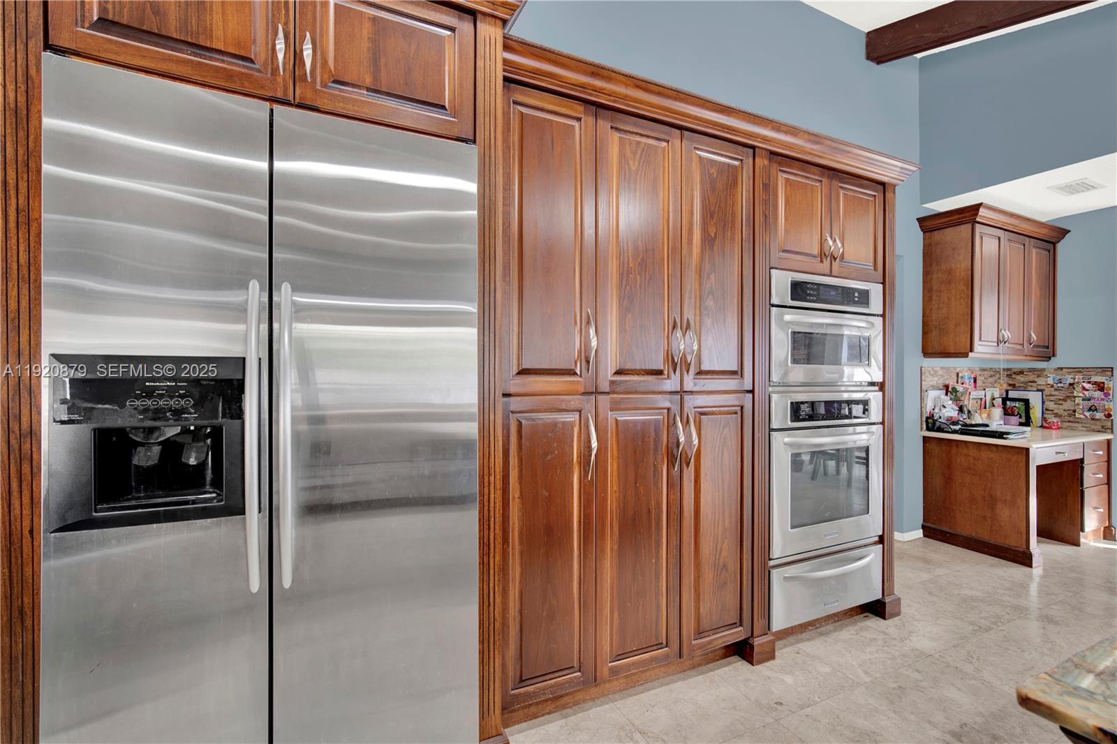 29472 Southwest 193rd Court Homestead, FL 33030 - Photo 18 of 44 a kitchen with stainless steel appliances granite countertop a refrigerator and a sink