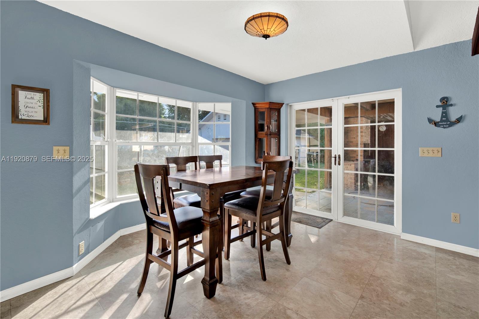 29472 Southwest 193rd Court Homestead, FL 33030 - Photo 20 of 44 a view of a dining room with furniture and a window