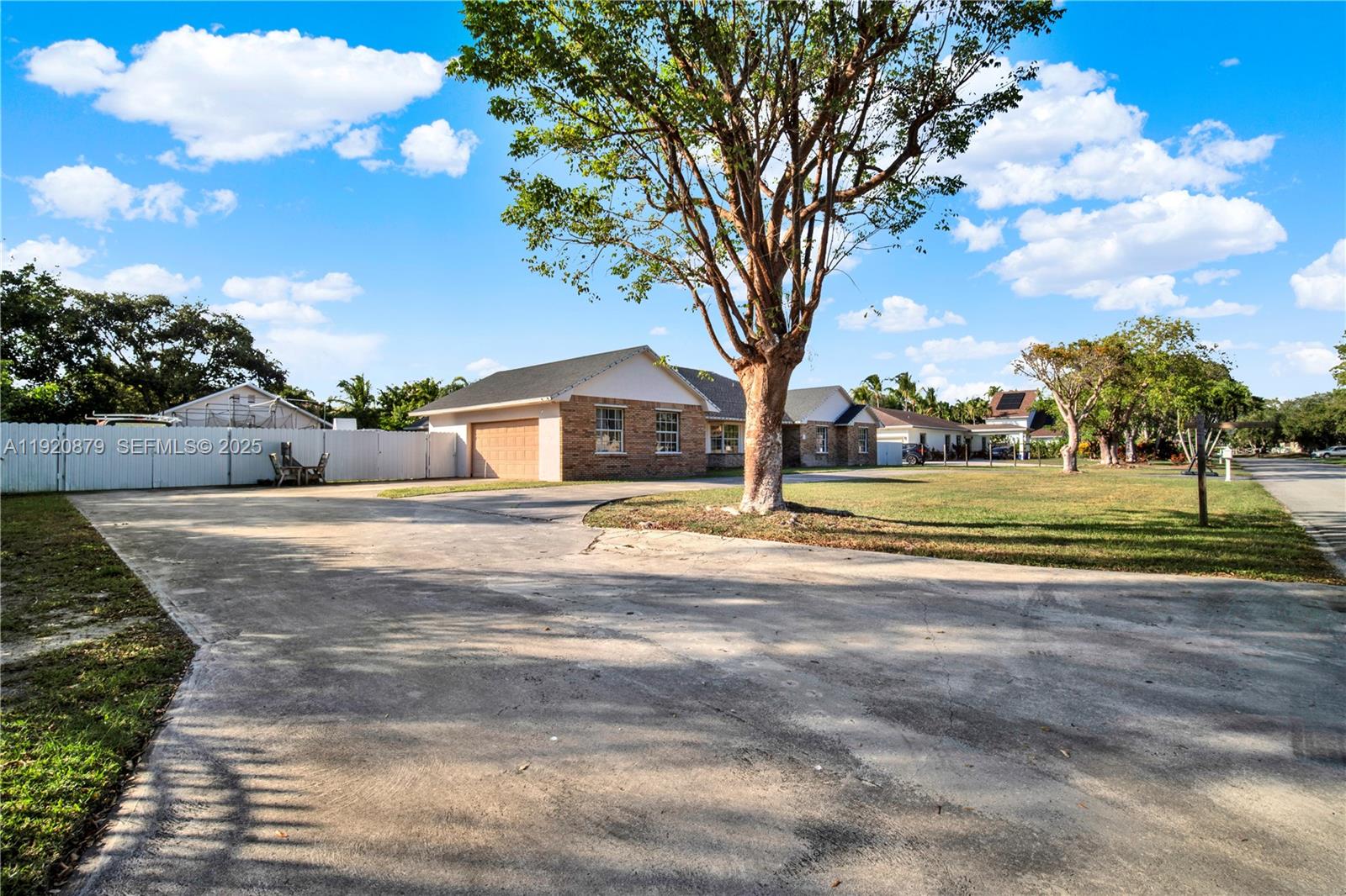 29472 Southwest 193rd Court Homestead, FL 33030 - Photo 2 of 44 a house view with a trees park