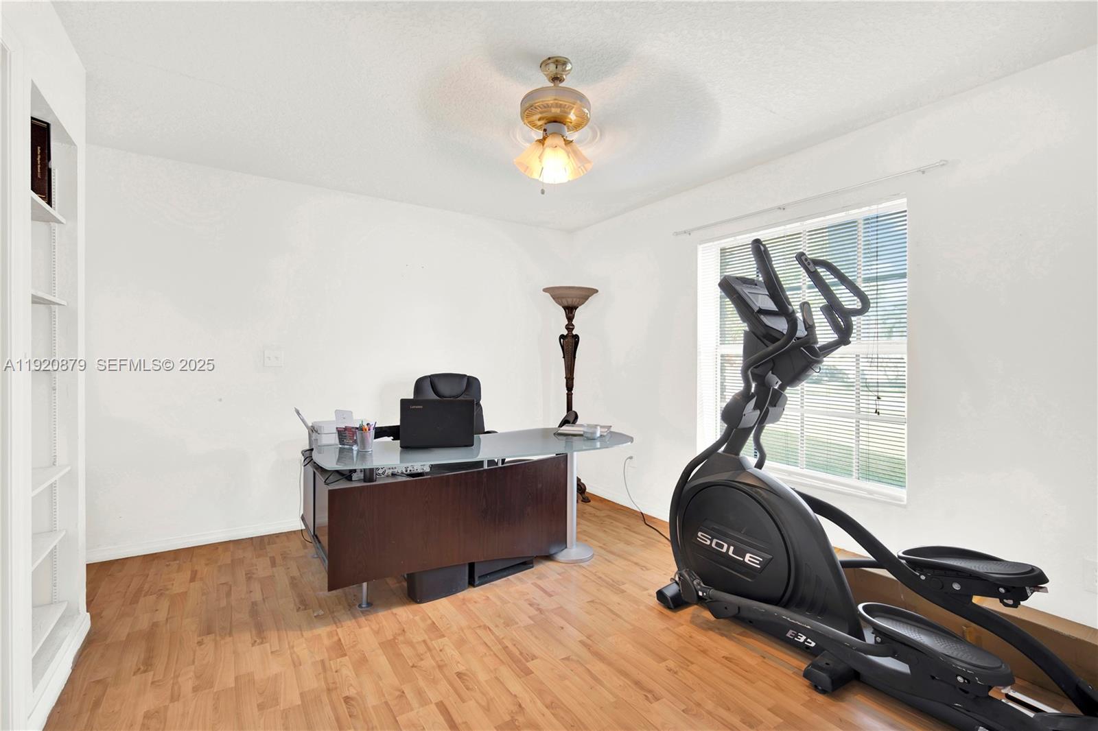 29472 Southwest 193rd Court Homestead, FL 33030 - Photo 21 of 44 a view of a room with gym equipment