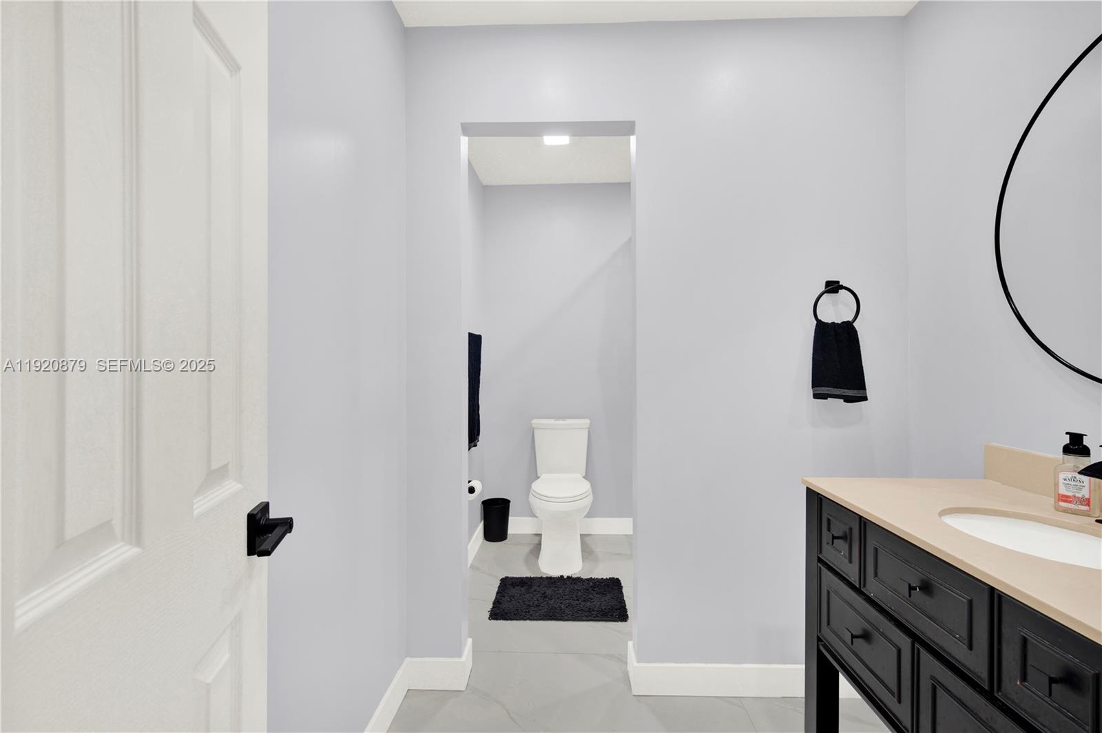 29472 Southwest 193rd Court Homestead, FL 33030 - Photo 25 of 44 a bathroom with a sink and mirror