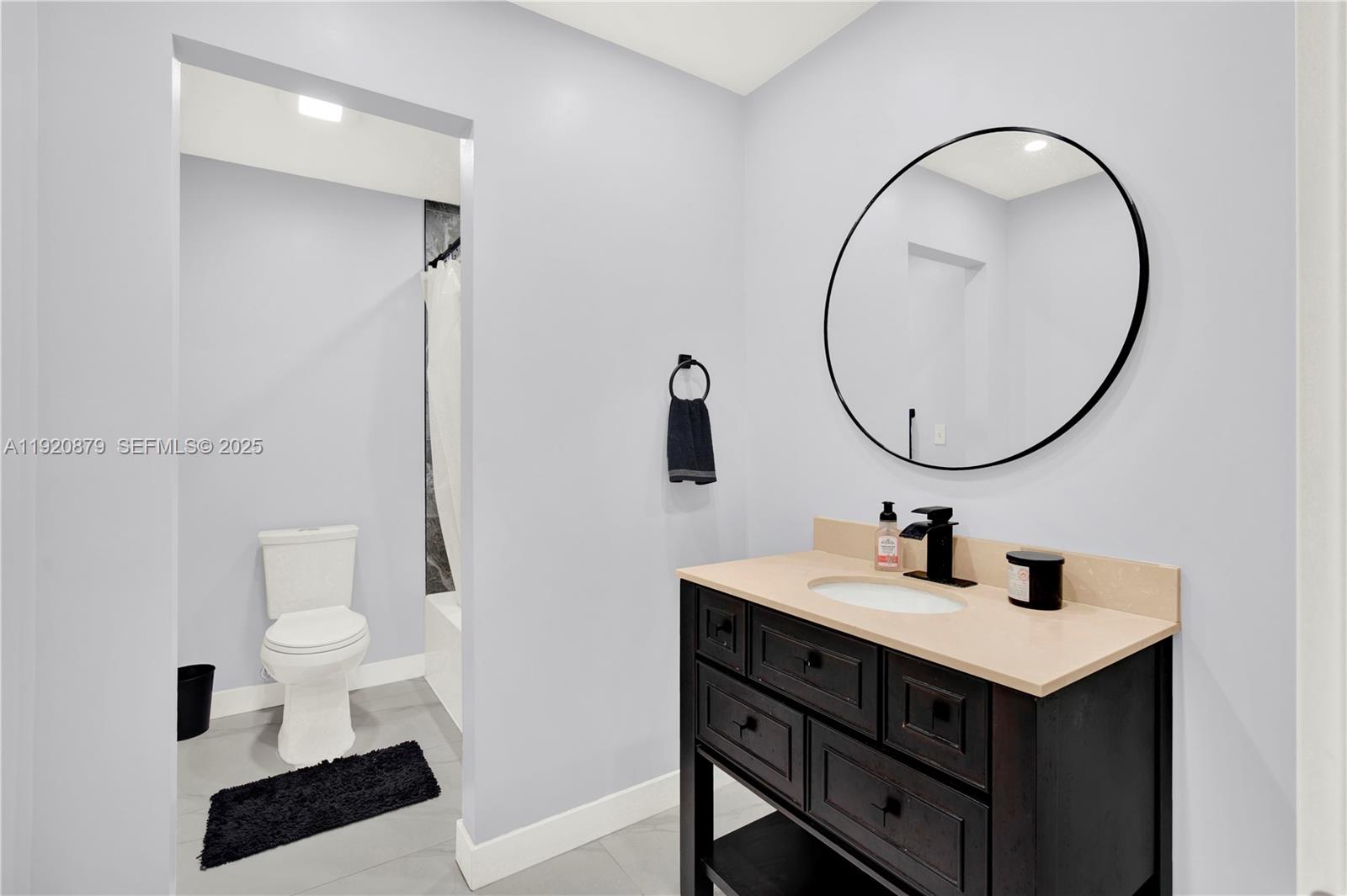29472 Southwest 193rd Court Homestead, FL 33030 - Photo 27 of 44 a bathroom with a sink and a mirror