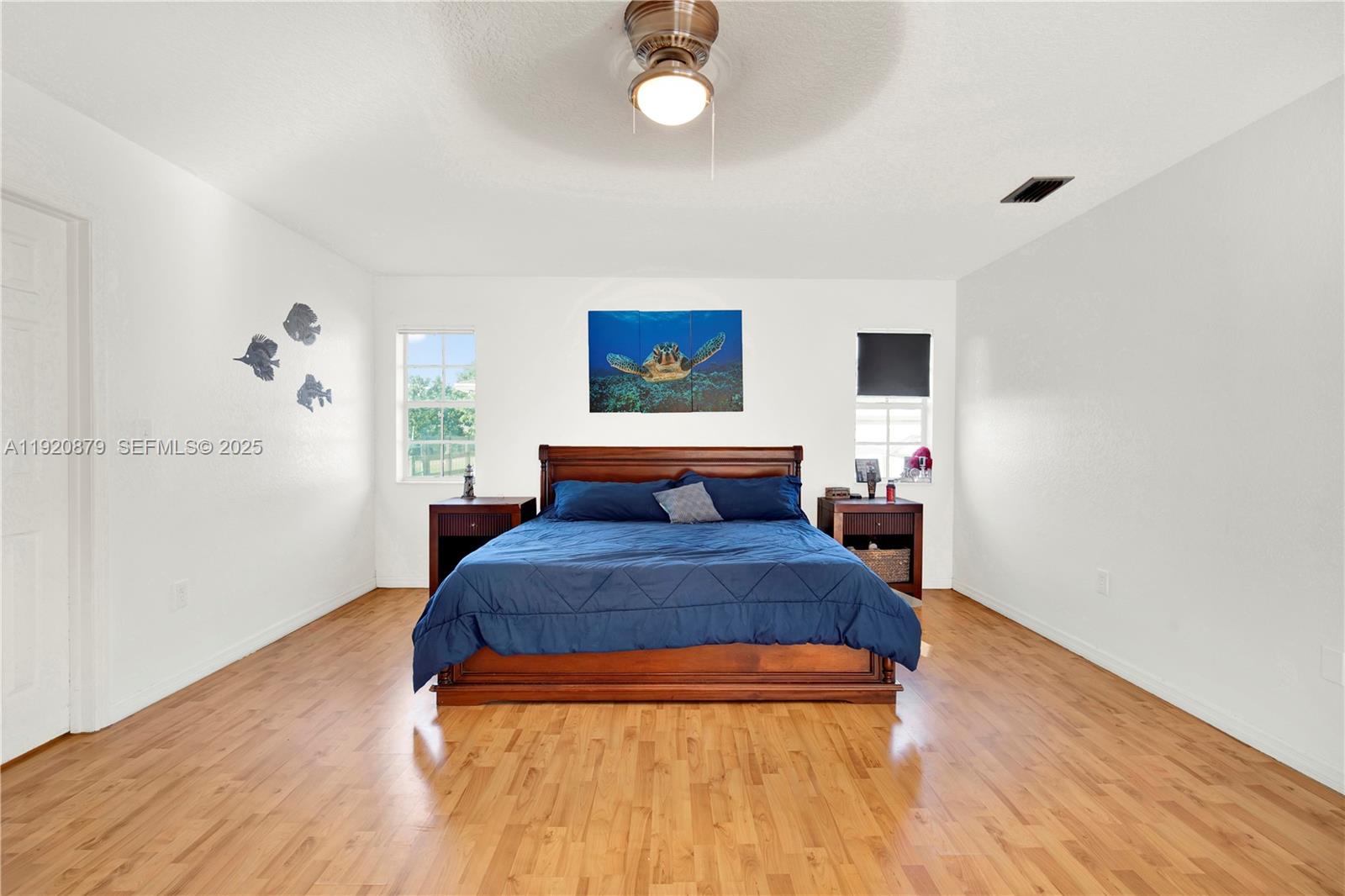29472 Southwest 193rd Court Homestead, FL 33030 - Photo 29 of 44 a bedroom with a bed and a potted plant