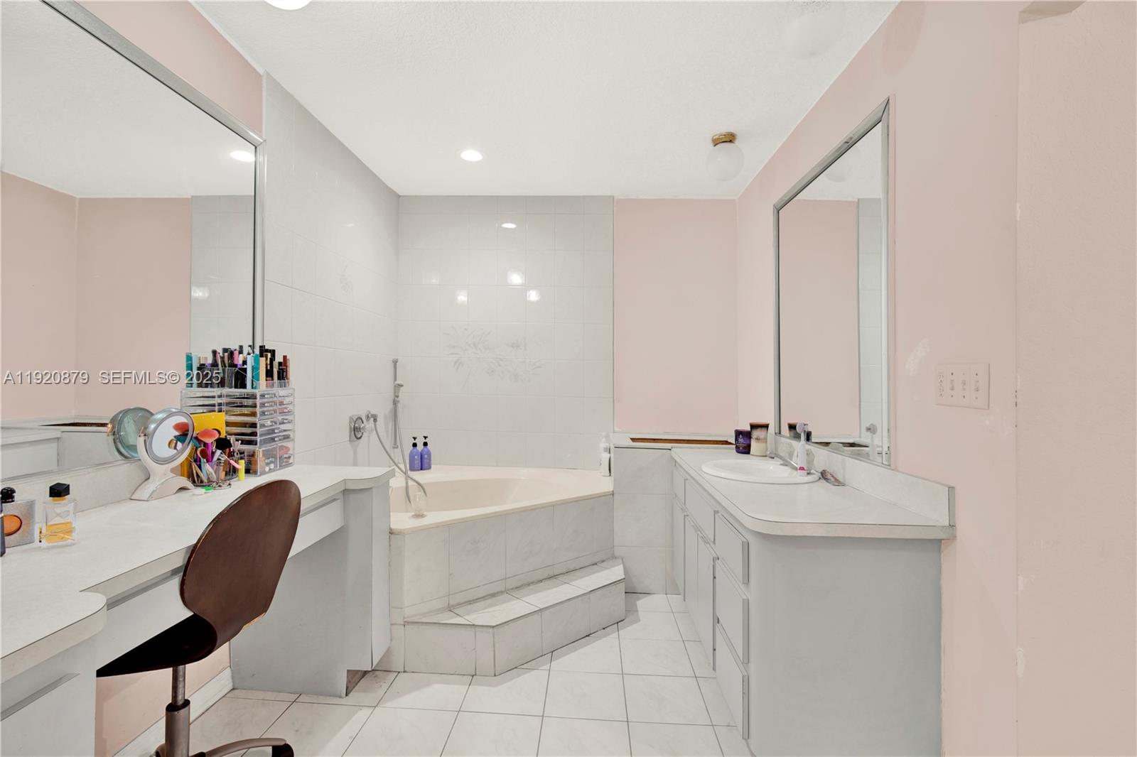 29472 Southwest 193rd Court Homestead, FL 33030 - Photo 32 of 44 a bathroom with a bathtub sink and mirror