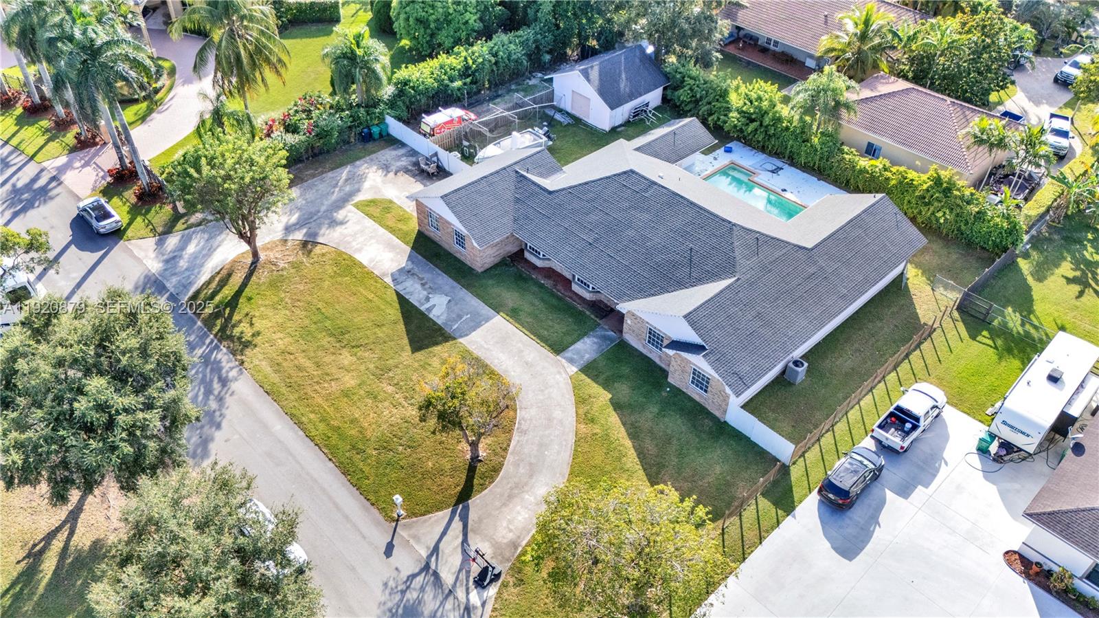 29472 Southwest 193rd Court Homestead, FL 33030 - Photo 42 of 44 an aerial view of a house with swimming pool and outdoor seating