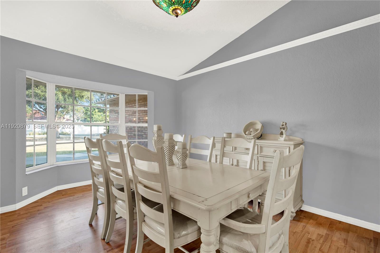 29472 Southwest 193rd Court Homestead, FL 33030 - Photo 10 of 44 a view of a dining room with furniture and wooden floor