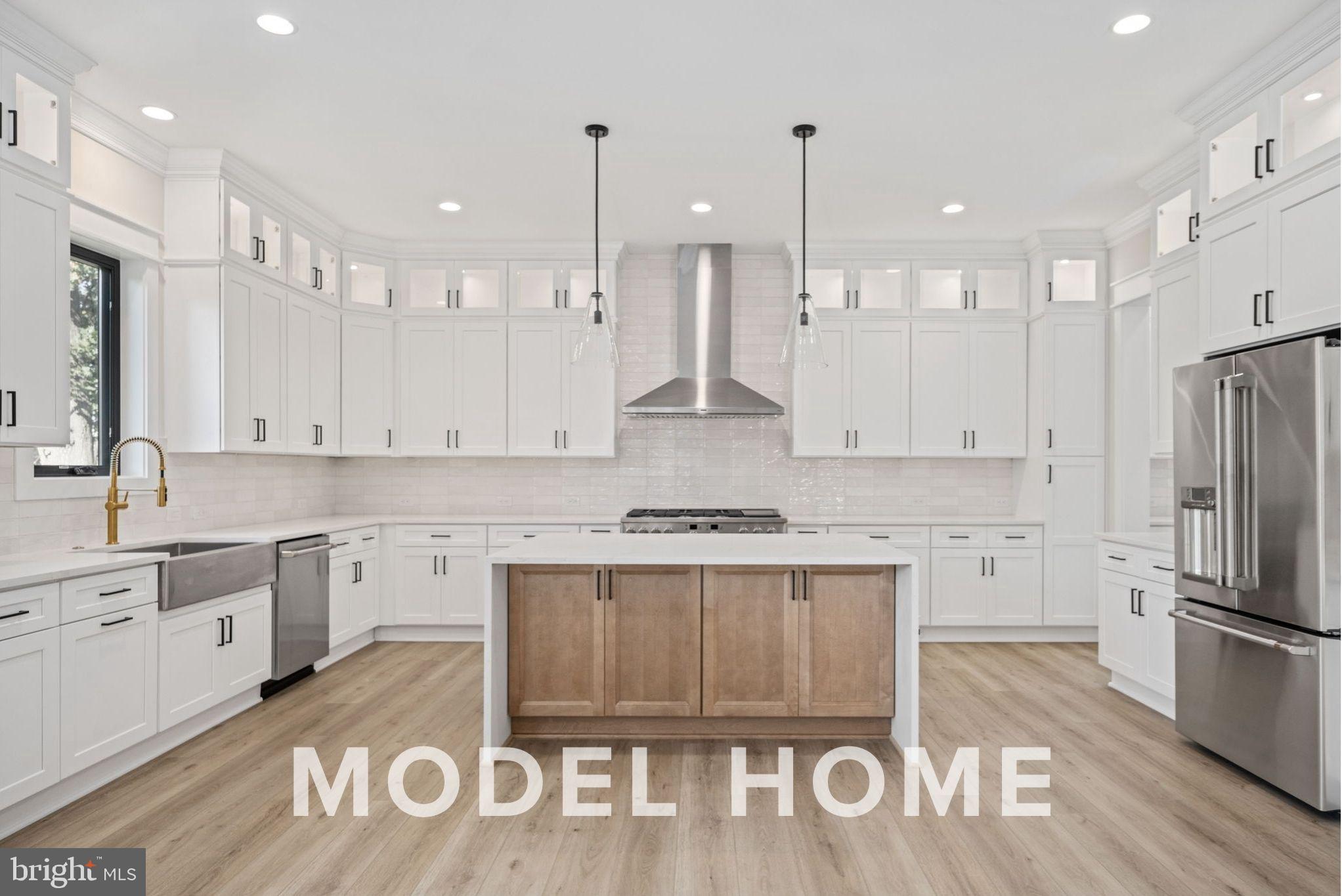 1901 Ware Road Falls Church, VA 22043 - Photo 14 of 39 a kitchen with a sink stove and refrigerator