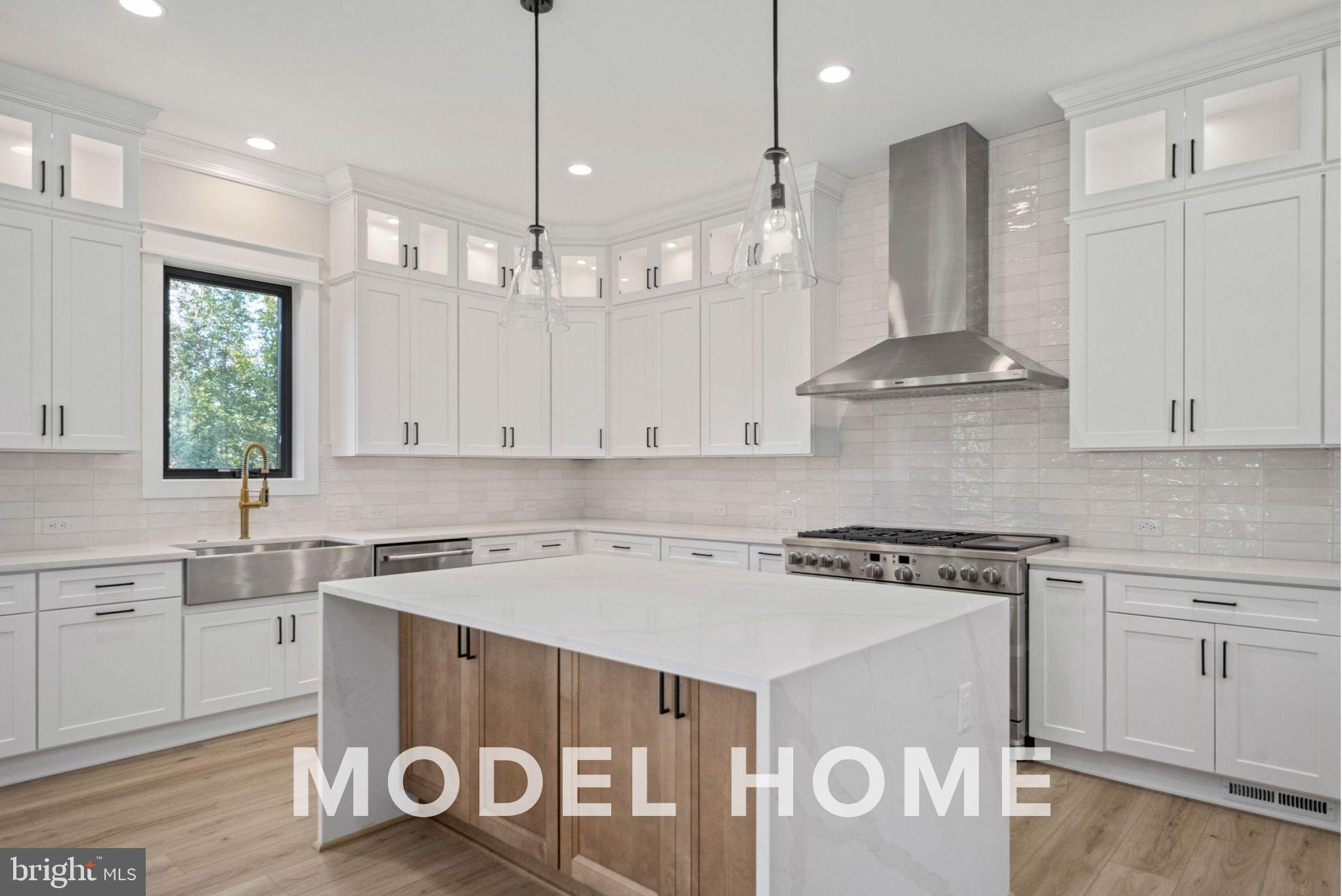 1901 Ware Road Falls Church, VA 22043 - Photo 15 of 39 a kitchen with a stove a sink and a refrigerator