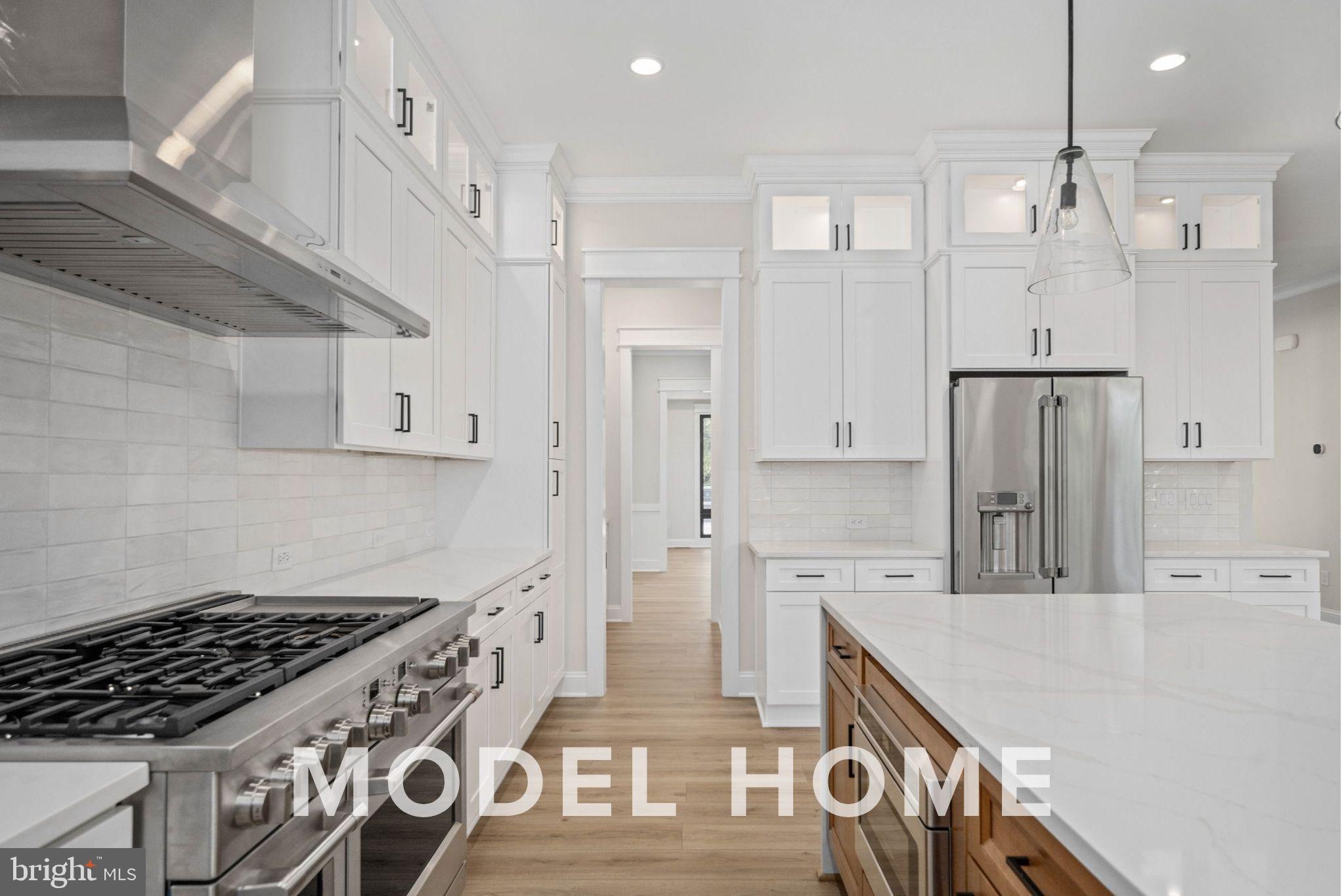 1901 Ware Road Falls Church, VA 22043 - Photo 18 of 39 a kitchen with stainless steel appliances granite countertop a stove and a refrigerator