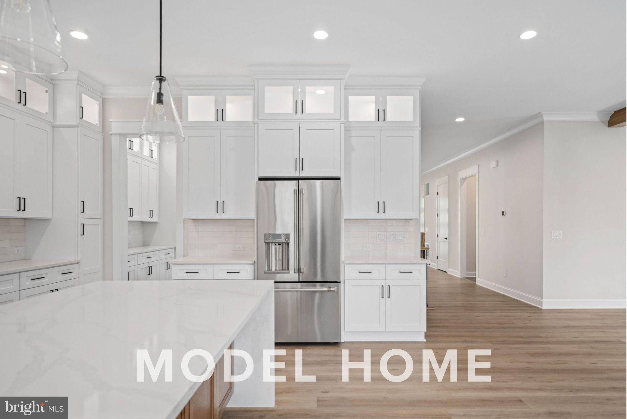 1901 Ware Road Falls Church, VA 22043 - Photo 19 of 39 a kitchen with kitchen island a counter top space cabinets and stainless steel appliances