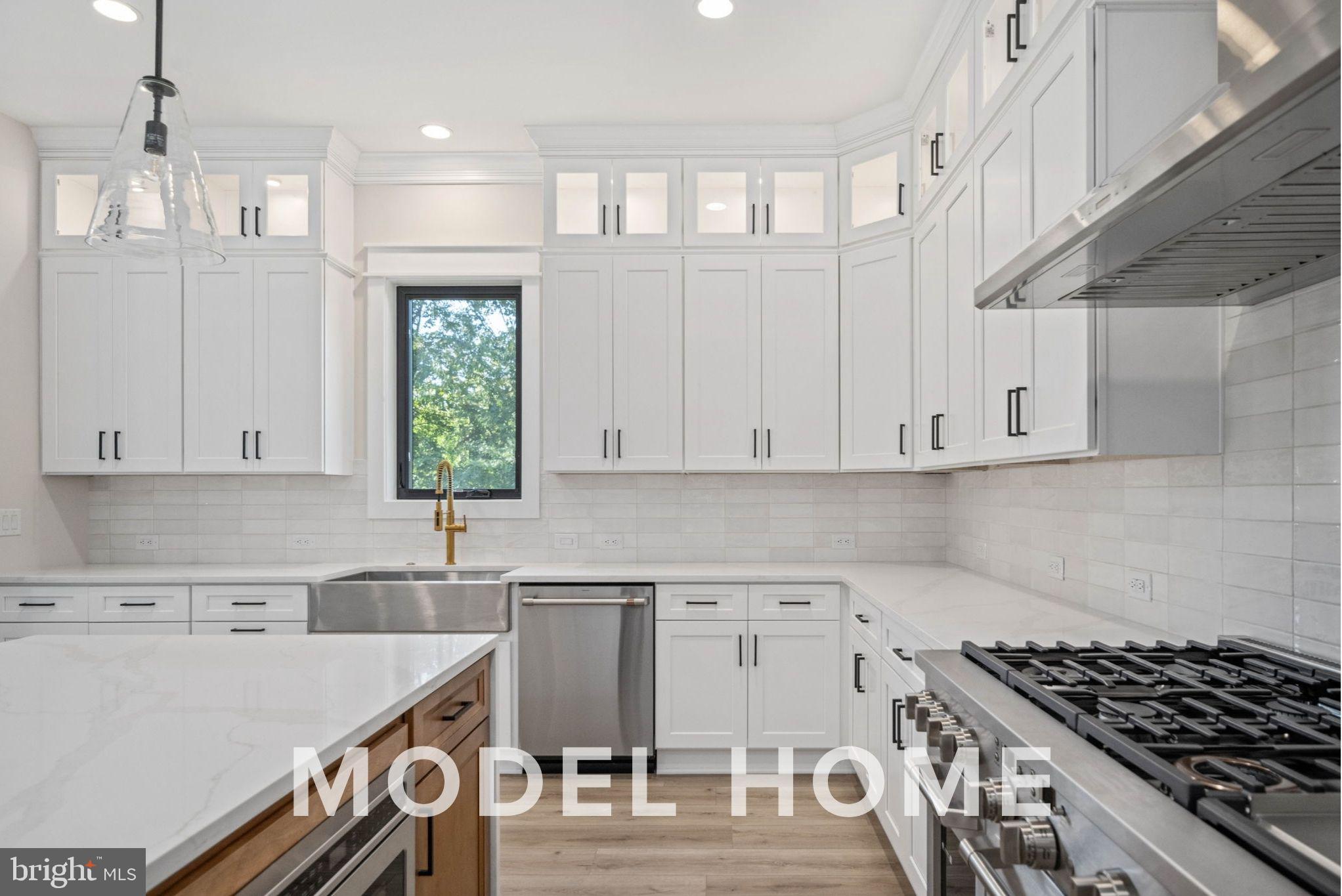 1901 Ware Road Falls Church, VA 22043 - Photo 21 of 39 a kitchen with a stove a sink and cabinets