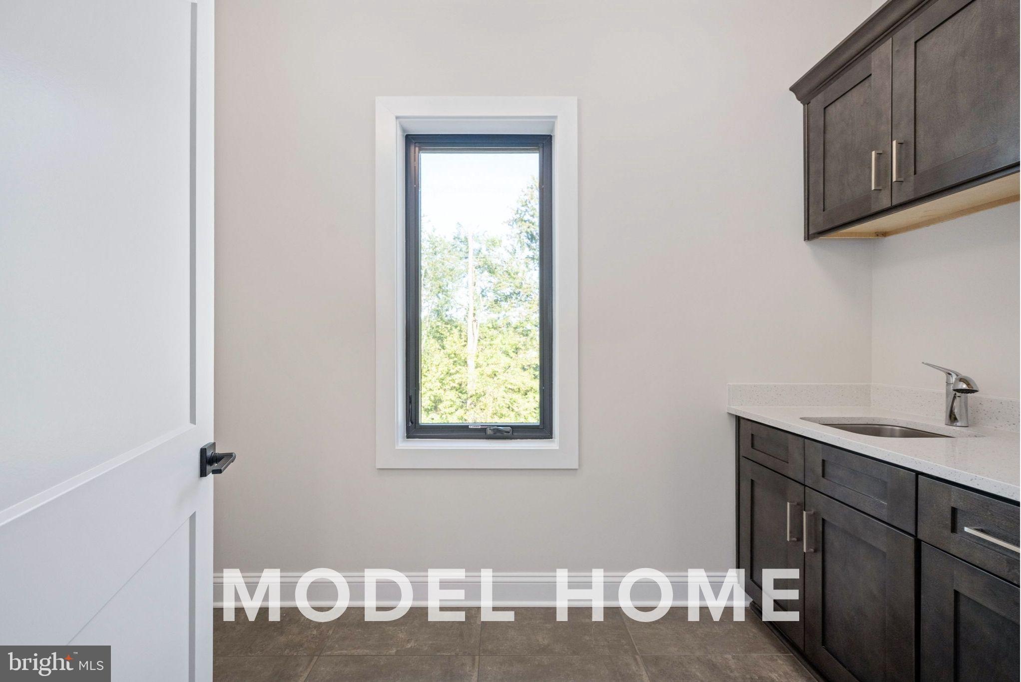 1901 Ware Road Falls Church, VA 22043 - Photo 24 of 39 a view of a kitchen with wooden floor and cabinets