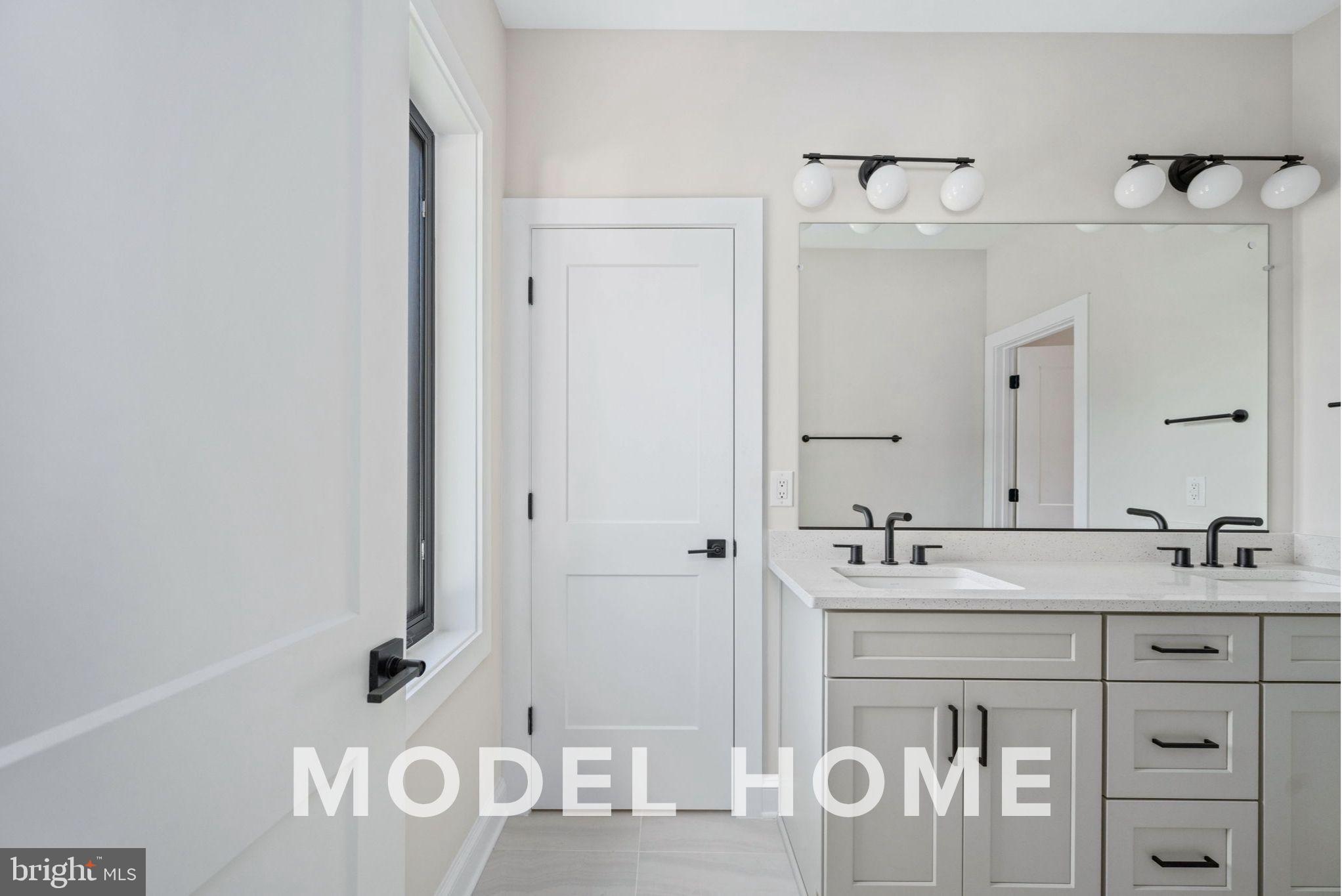 1901 Ware Road Falls Church, VA 22043 - Photo 25 of 39 a bathroom with a sink vanity and a mirror