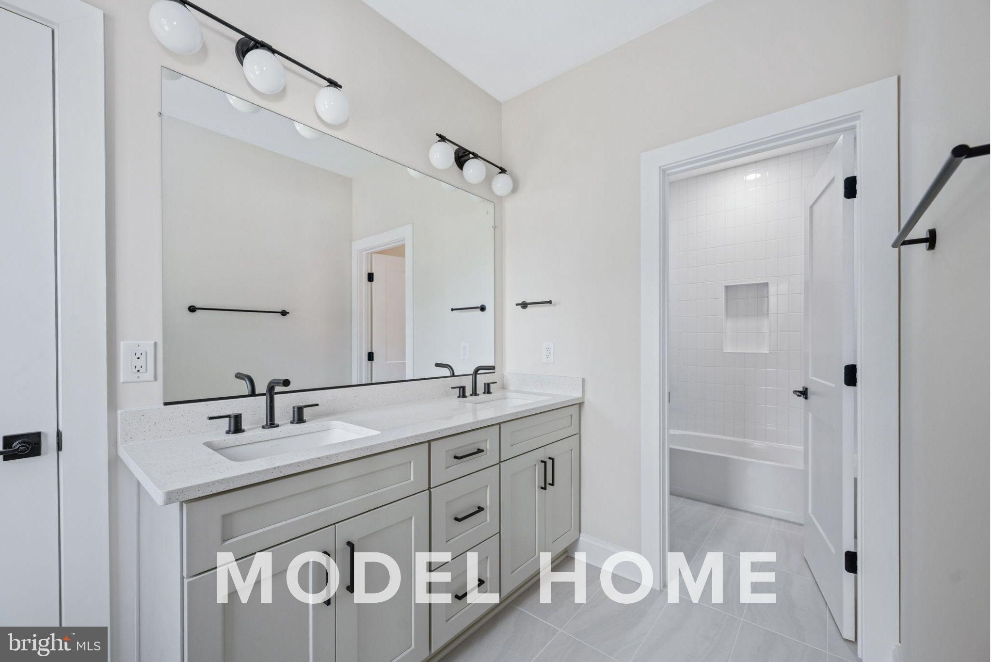1901 Ware Road Falls Church, VA 22043 - Photo 26 of 39 a bathroom with a sink a mirror and a shower