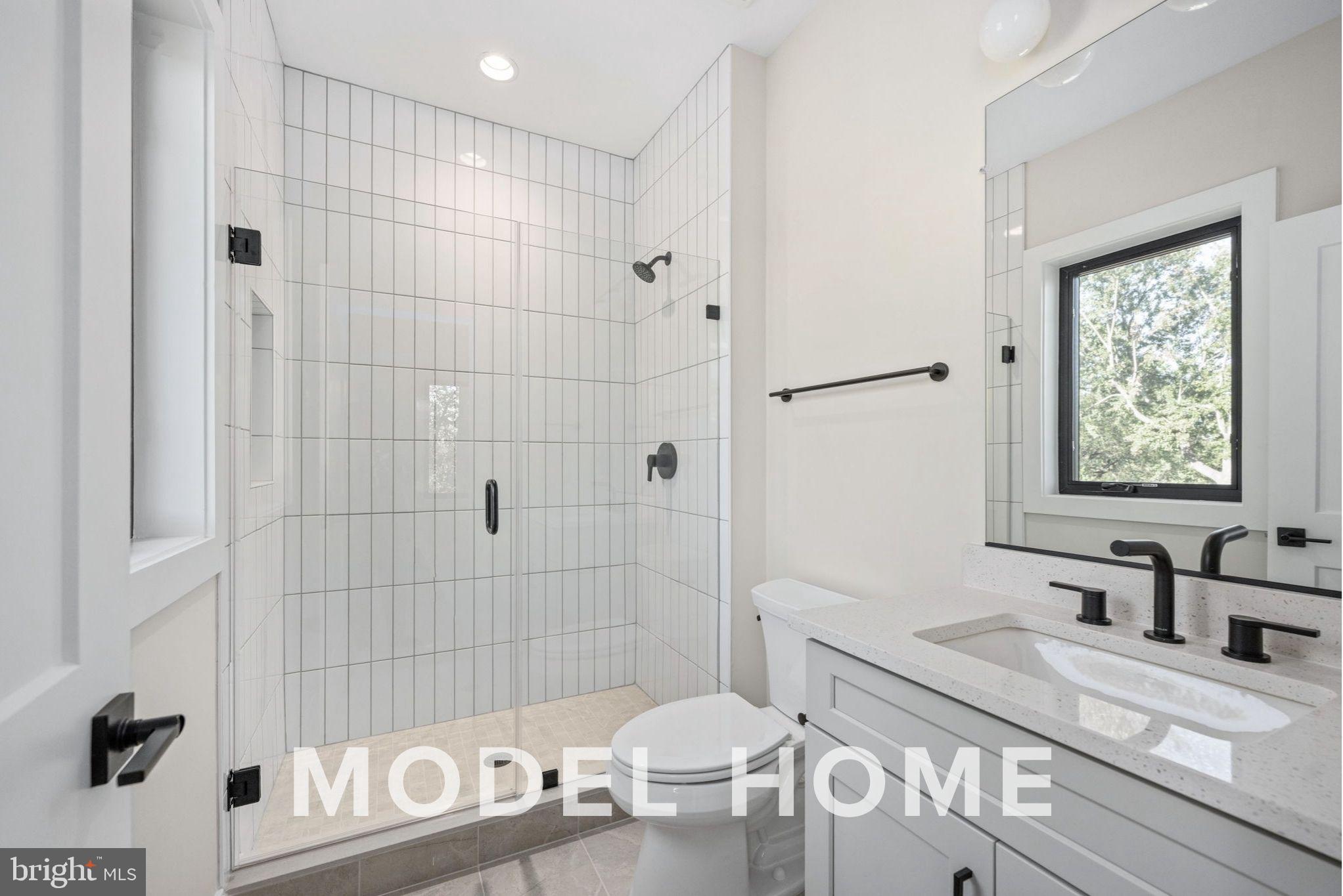 1901 Ware Road Falls Church, VA 22043 - Photo 28 of 39 a bathroom with a sink a toilet and shower