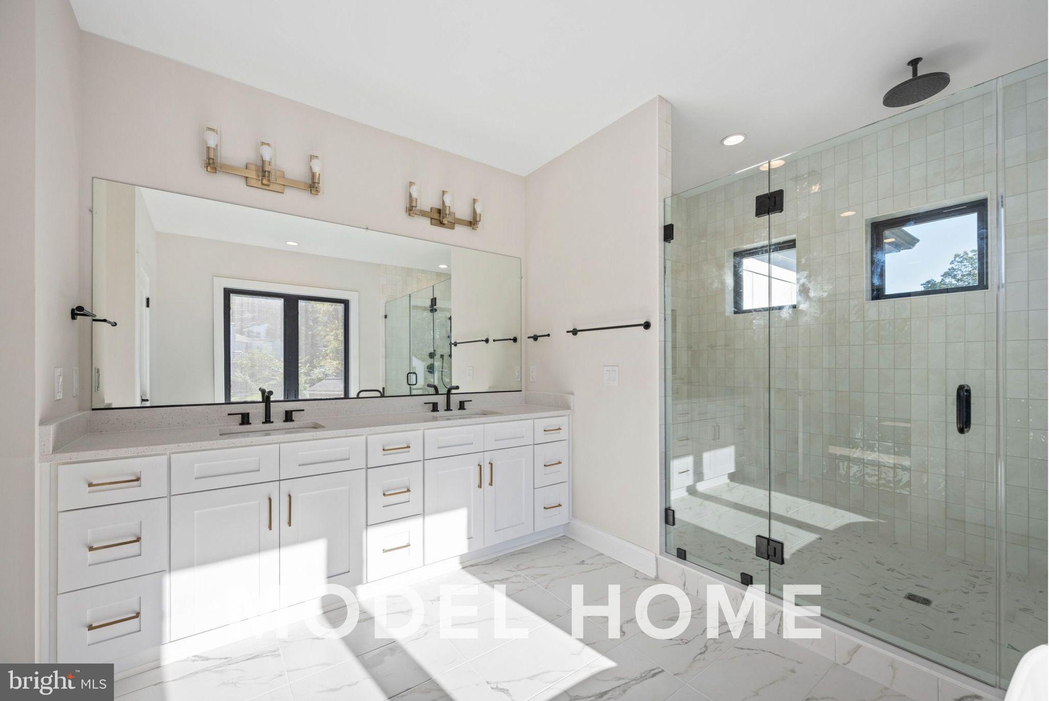 1901 Ware Road Falls Church, VA 22043 - Photo 31 of 39 a spacious bathroom with a granite countertop sink mirror and shower