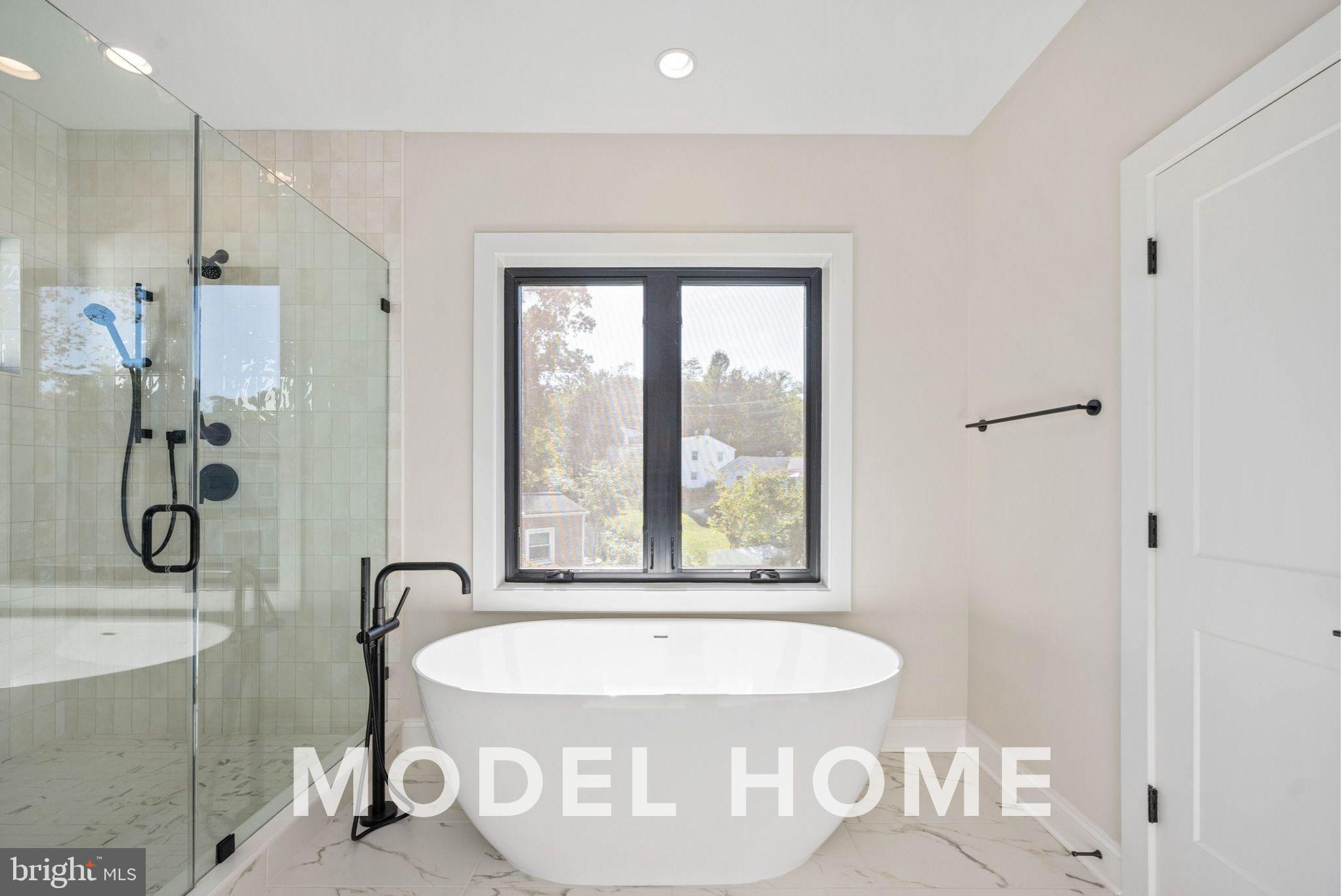 1901 Ware Road Falls Church, VA 22043 - Photo 34 of 39 a bathroom with a granite countertop sink a toilet and shower