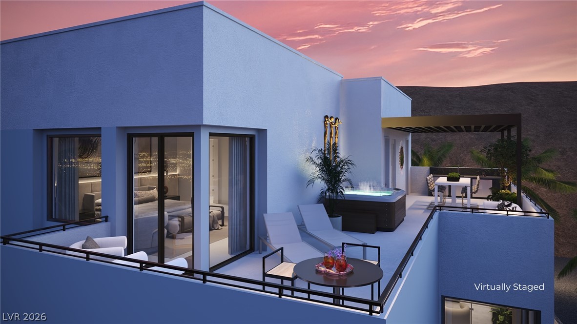 505 Overlook Rim Drive Henderson, NV 89012 - Photo 2 of 22 A spacious wrap around third floor deck offers dazzling strip and mountain vistas, perfect for evening relaxation.