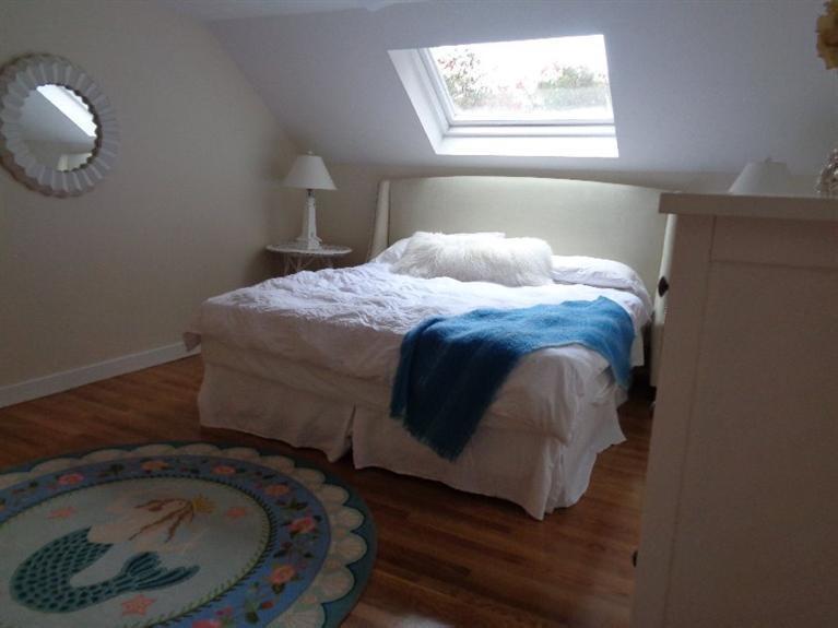 23 Tupelo Road Marstons Mills, MA 02648 - Photo 14 of 22 a bed sitting in a bedroom next to a window