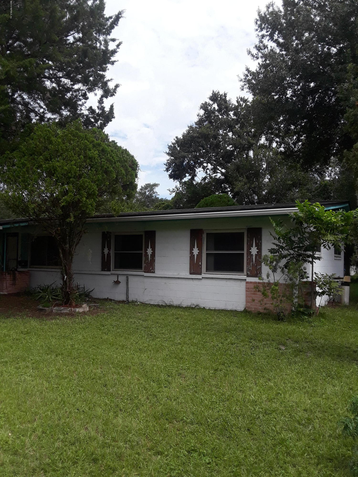 7531 Strato Road Jacksonville, FL 32210 - Photo 4 of 5 a front view of house with yard and trees