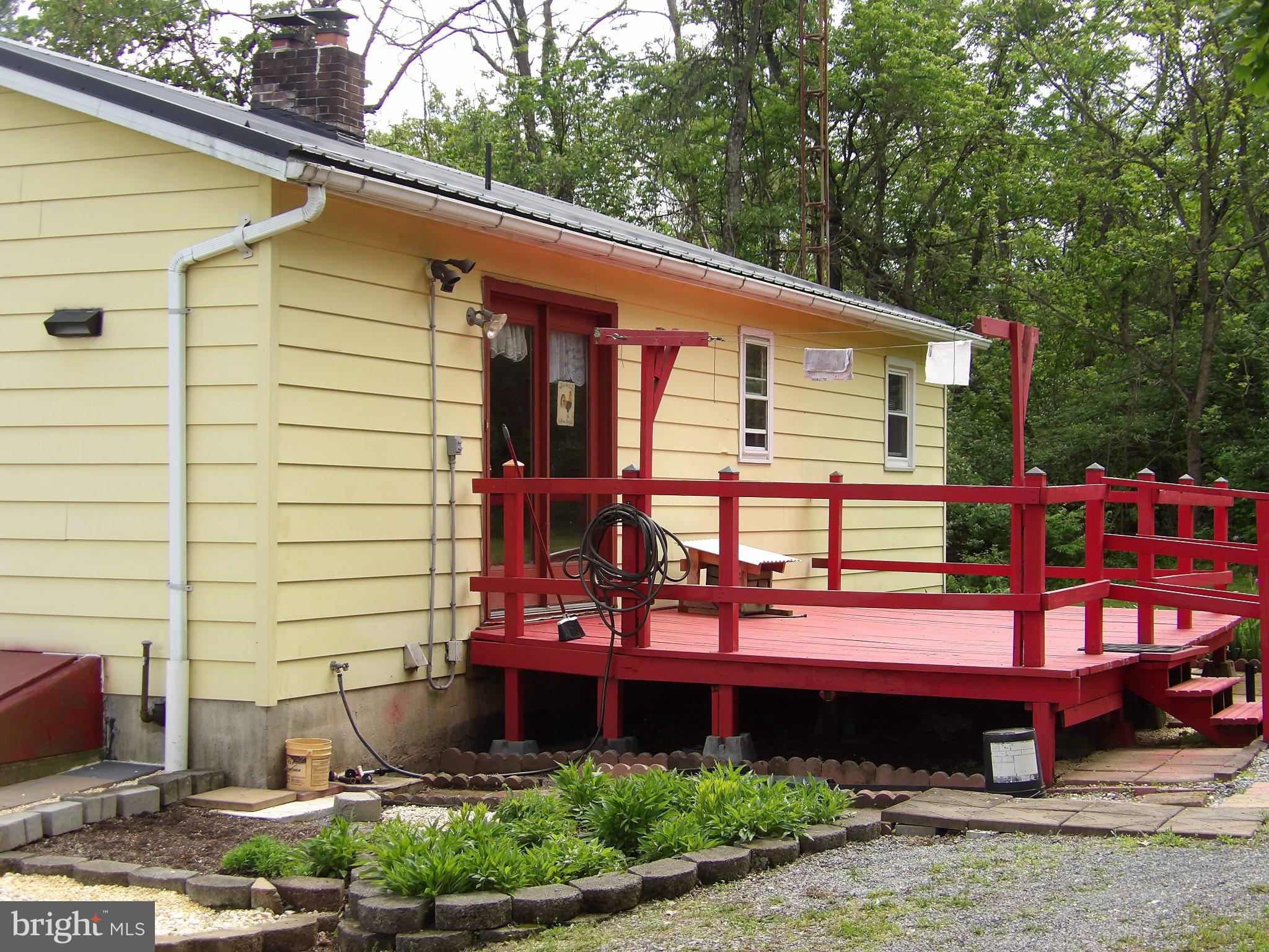 1045 Lockport Road Lewistown, PA 17044 - Photo 39 of 51 Charming yellow home with vibrant deck.
