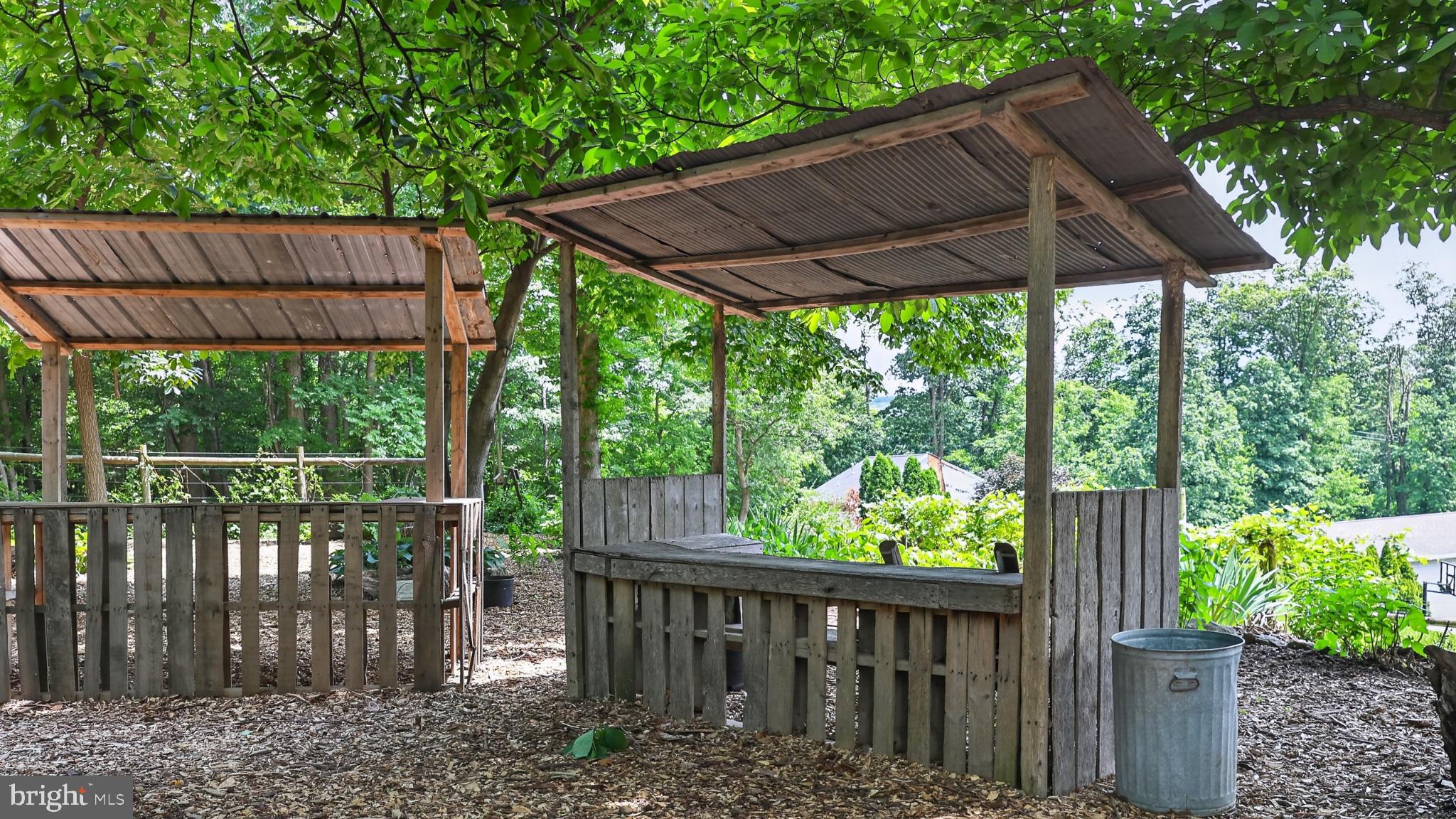 257 Hill Road New Holland, PA 17557 - Photo 89 of 94 Rustic garden market under leafy canopies.